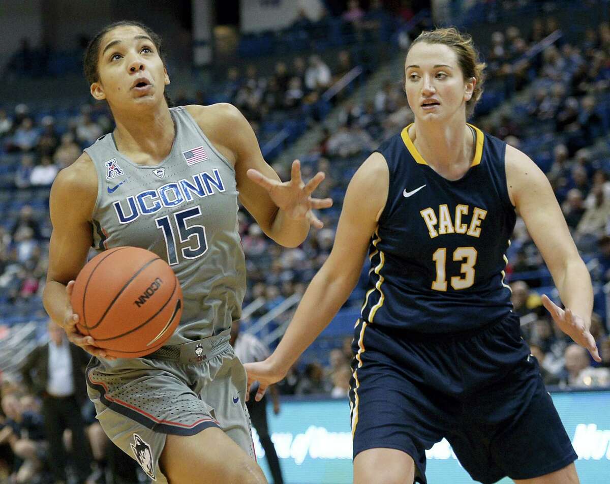 Connecticut's Gabby Williams drives to the basket as Pace's Kirsten Dodge, right, defends, in the first half of a preseason NCAA college basketball game, Sunday, Nov. 6, 2016, in Hartford, Conn. (AP Photo/Jessica Hill)