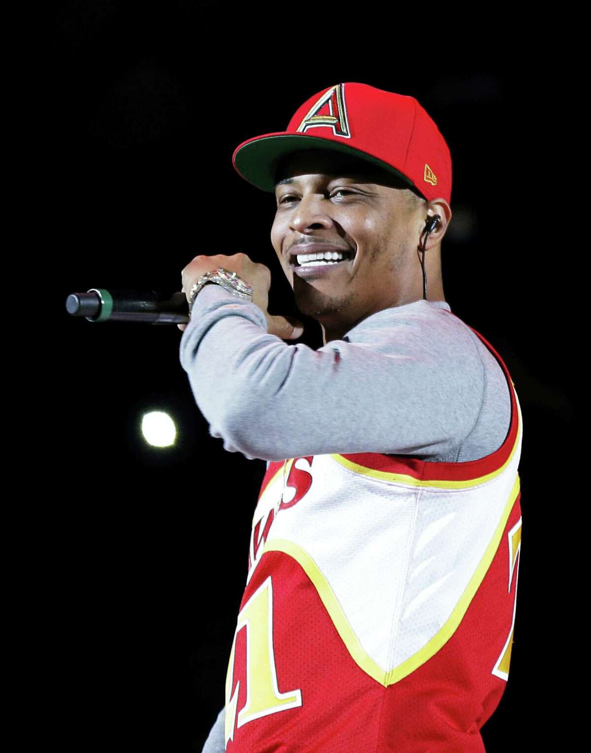 Rapper T.I. performs before the start of a game between the Indiana Pacers and the Atlanta Hawks in Atlanta. The Hawks are collaborating with big-name hip-hop artists like T.I., Ludacris and Big Boi in what the team calls an effort to make amends after it was revealed two officials made racially charged remarks in separate incidents.