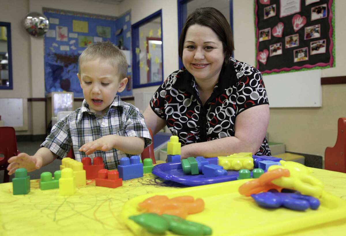 Kelly Andrus plays with her son Bradley, in his classroom at Children’s Choice Learning Centers Inc., in Lewisville, Texas. Bradley has been diagnosed with mild autism.