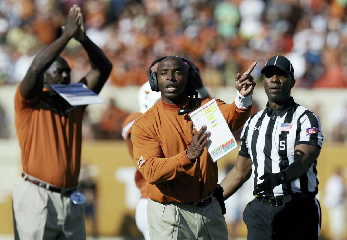 In this Oct. 29, 2016 photo, Texas coach Charlie Strong signals to officials during the team’s NCAA college football game against Baylor in Austin, Texas. Texas plays West Virginia in Austin this week.