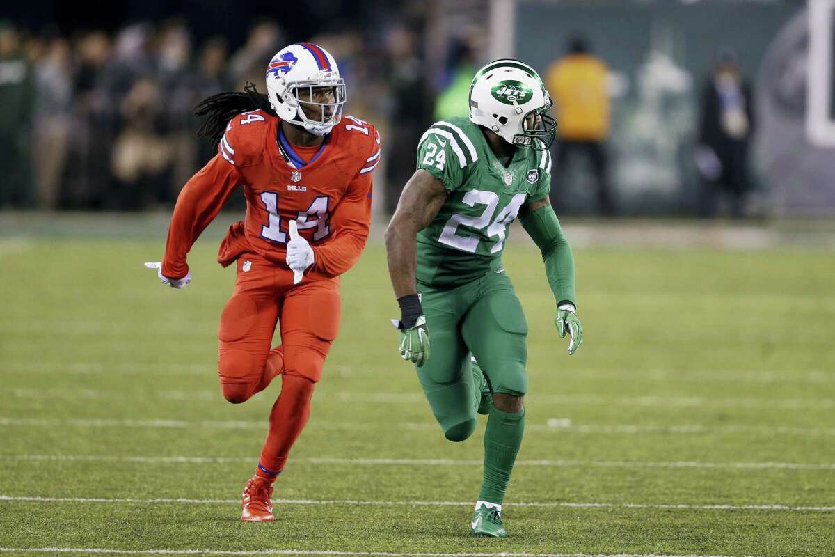 In this Nov. 12, 2015 photo, Buffalo Bills wide receiver Sammy Watkins, left, is defended by New York Jets cornerback Darrelle Revis during the first half of an NFL football game, in East Rutherford, N.J. The NFL isn’t colorblind to the concerns of its TV audience regarding the “Color Rush” alternate uniforms the Bills and Jets will wear Thursday night Sept. 14, 2016.