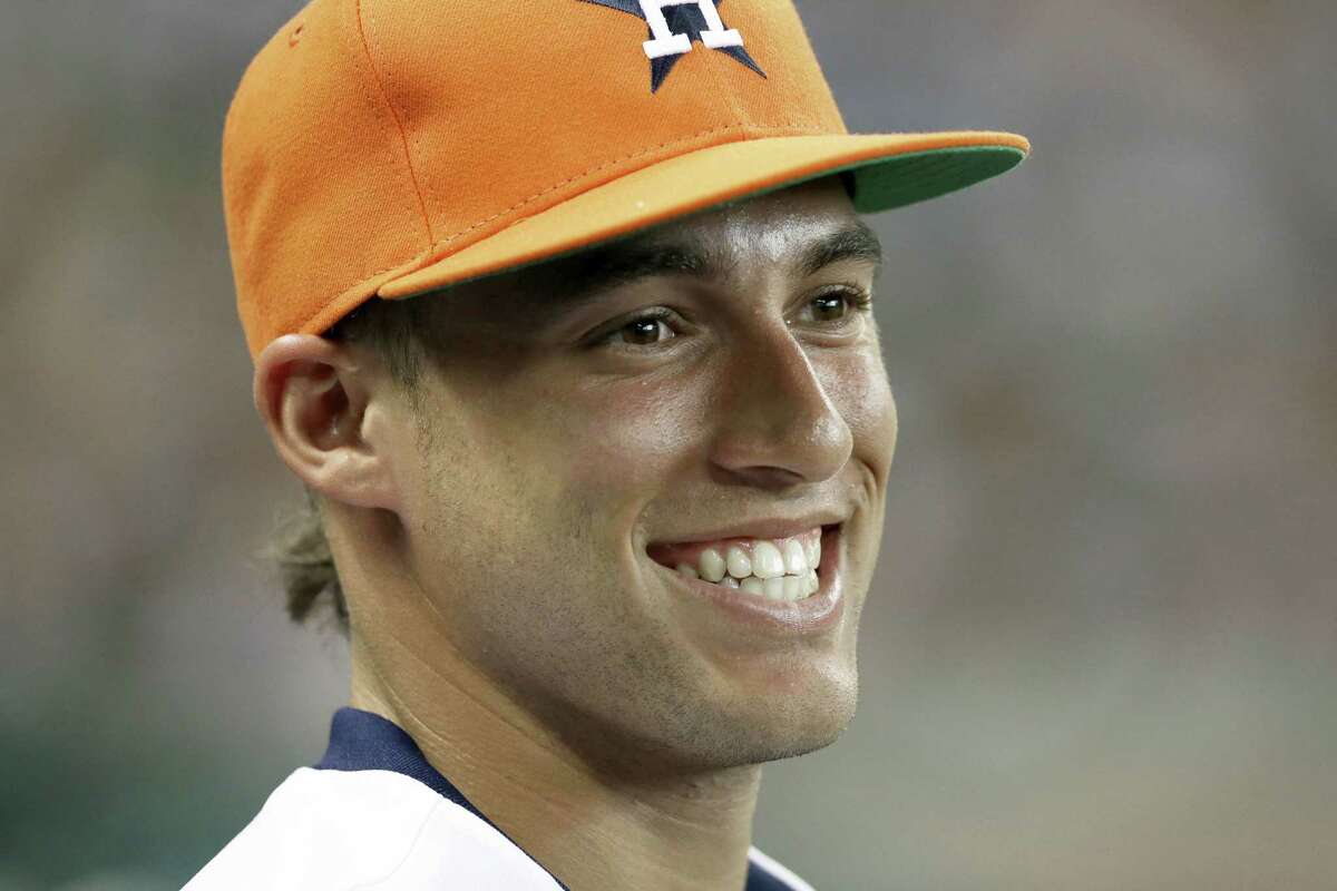 Houston Astros' George Springer smiles during a baseball game between the Houston Astros and the Texas Rangers Saturday, July 18, 2015, in Houston. (AP Photo/Pat Sullivan)