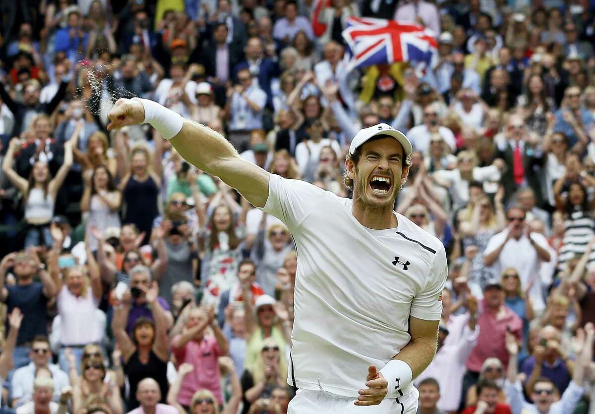 Andy Murray celebrates after beating Milos Raonic in the men’s singles final at Wimbledon on Sunday.