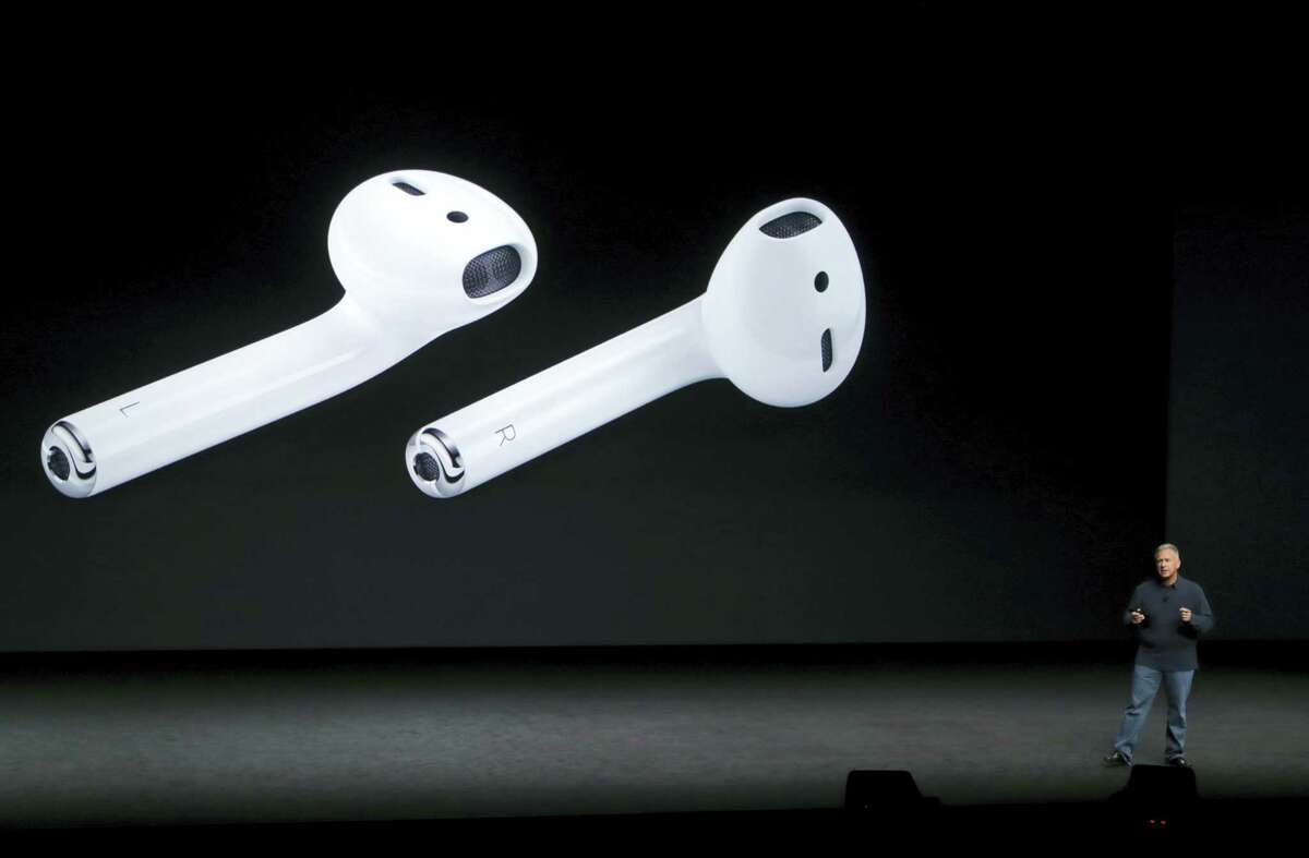 Phil Schiller, Apple’s senior vice president of worldwide marketing, talks about AirPods during an event to announce new products, in San Francisco.