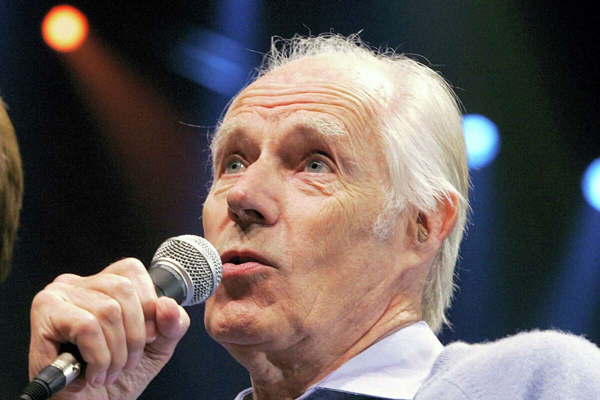 In this May 24, 2006, file photo, Beatles producer Sir George Martin answers a question from the media after the sneak preview of a new Beatles-themed Cirque du Soleil show, “Love,” in Las Vegas on Wednesday, May 24, 2006.