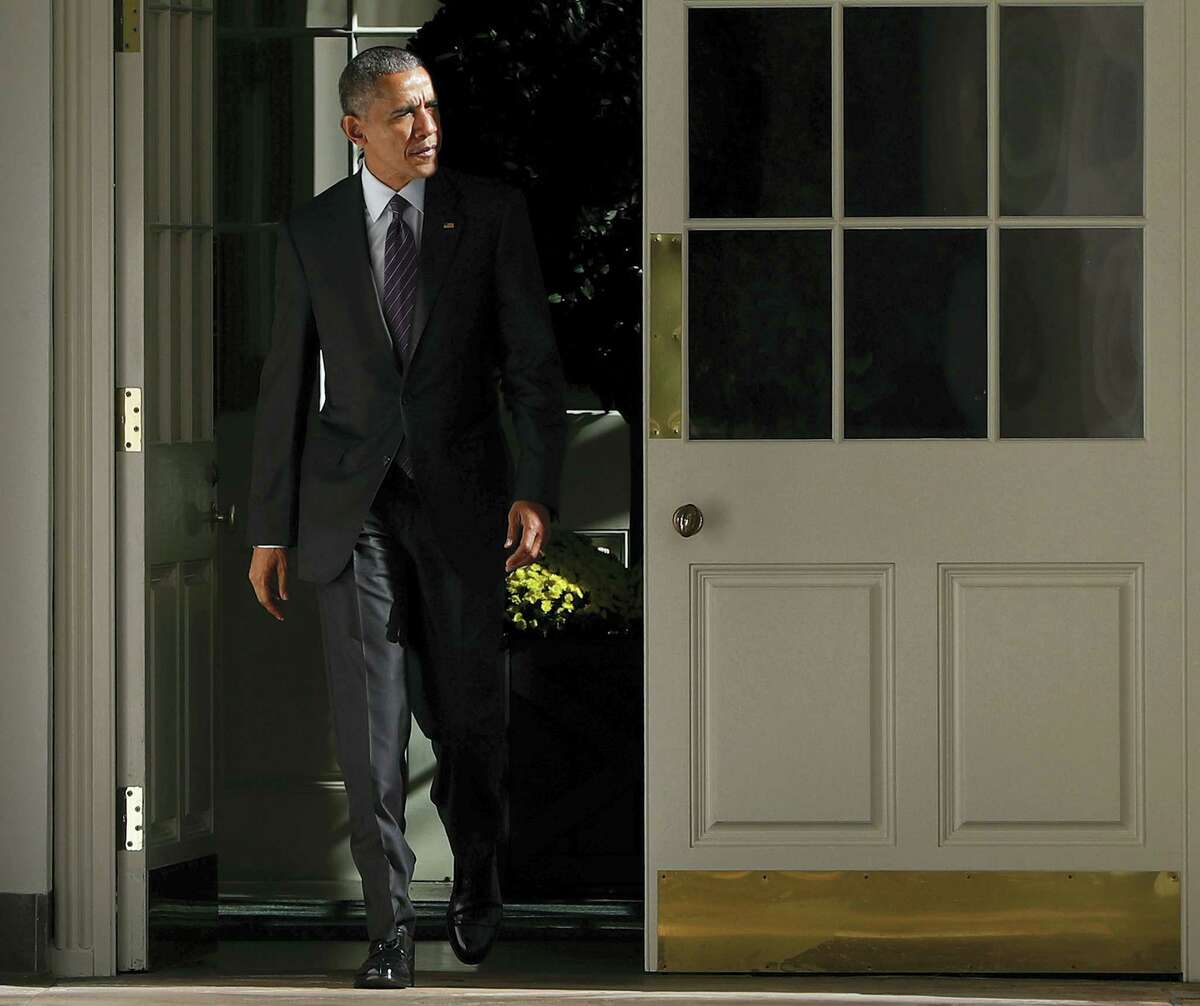President Barack Obama walks out of the main residence of the White House and down the Colonnade and heads towards the Oval Office onTuesday, Nov. 8, 2016 in Washington.