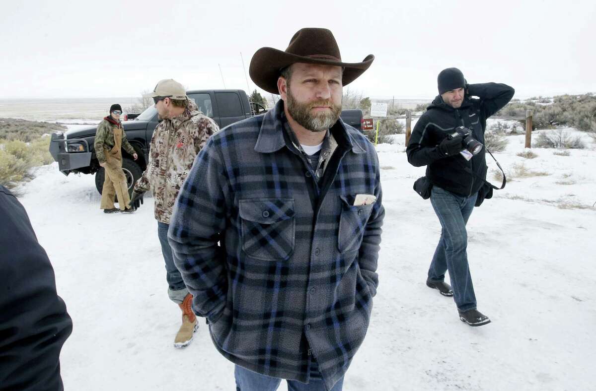 Ammon Bundy, one of the sons of Nevada rancher Cliven Bundy, arrives for an interview at Malheur National Wildlife Refuge, Tuesday, Jan. 5, 2016, near Burns, Ore. Law enforcement had yet to take any action Tuesday against a group numbering close to two dozen, led by Bundy and his brother, who are upset over federal land policy.