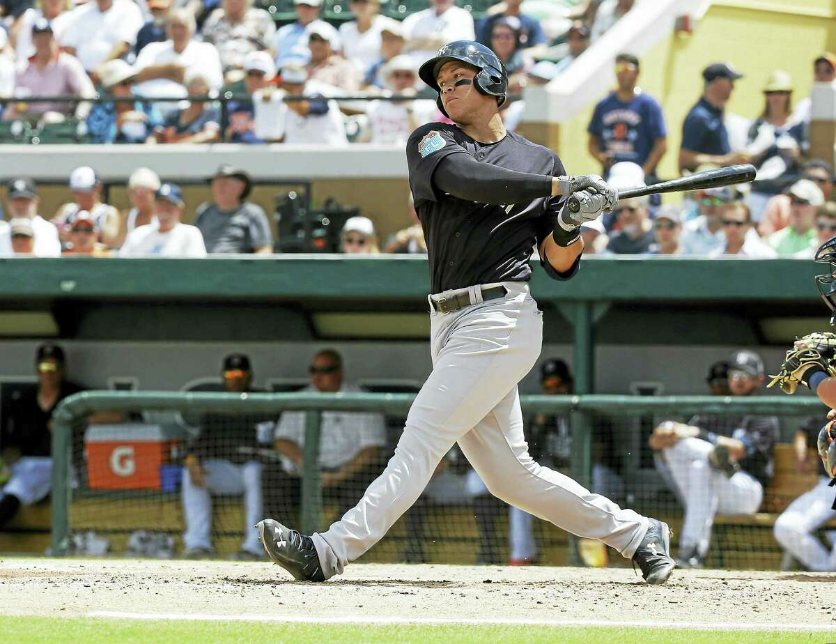 Aaron Judge bats against the Tigers during spring training.