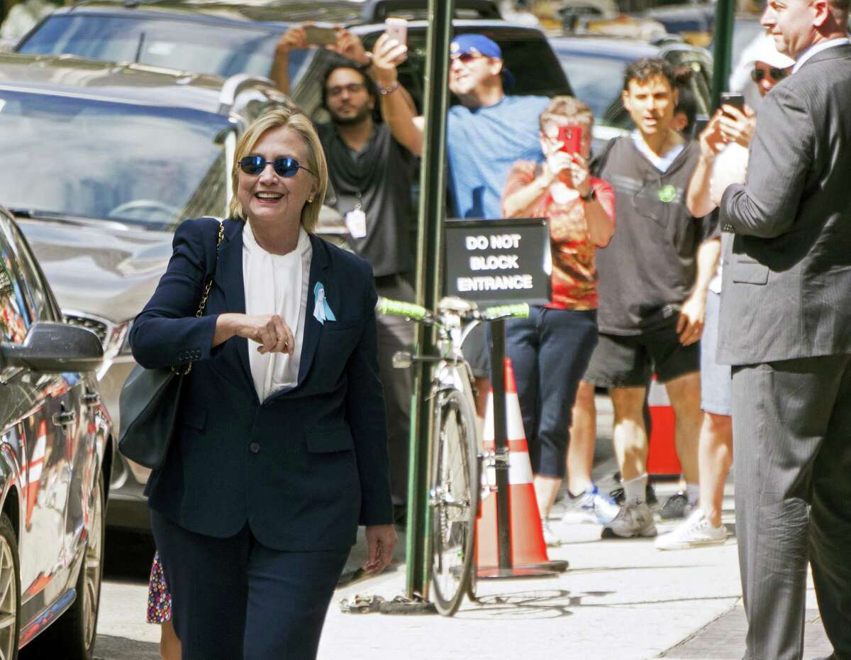 Democratic presidential candidate Hillary Clinton walks from from her daughter’s apartment building on Sept. 11, 2016, in New York. Clinton unexpectedly left Sunday’s 9/11 anniversary ceremony in New York after feeling “overheated,” according to her campaign.