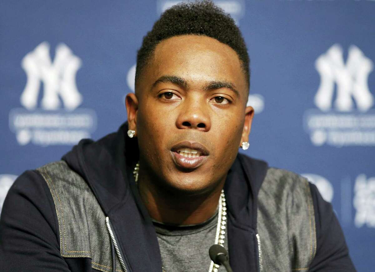 Aroldis Chapman answers a question during a press conference at Yankee Stadium on Sunday.