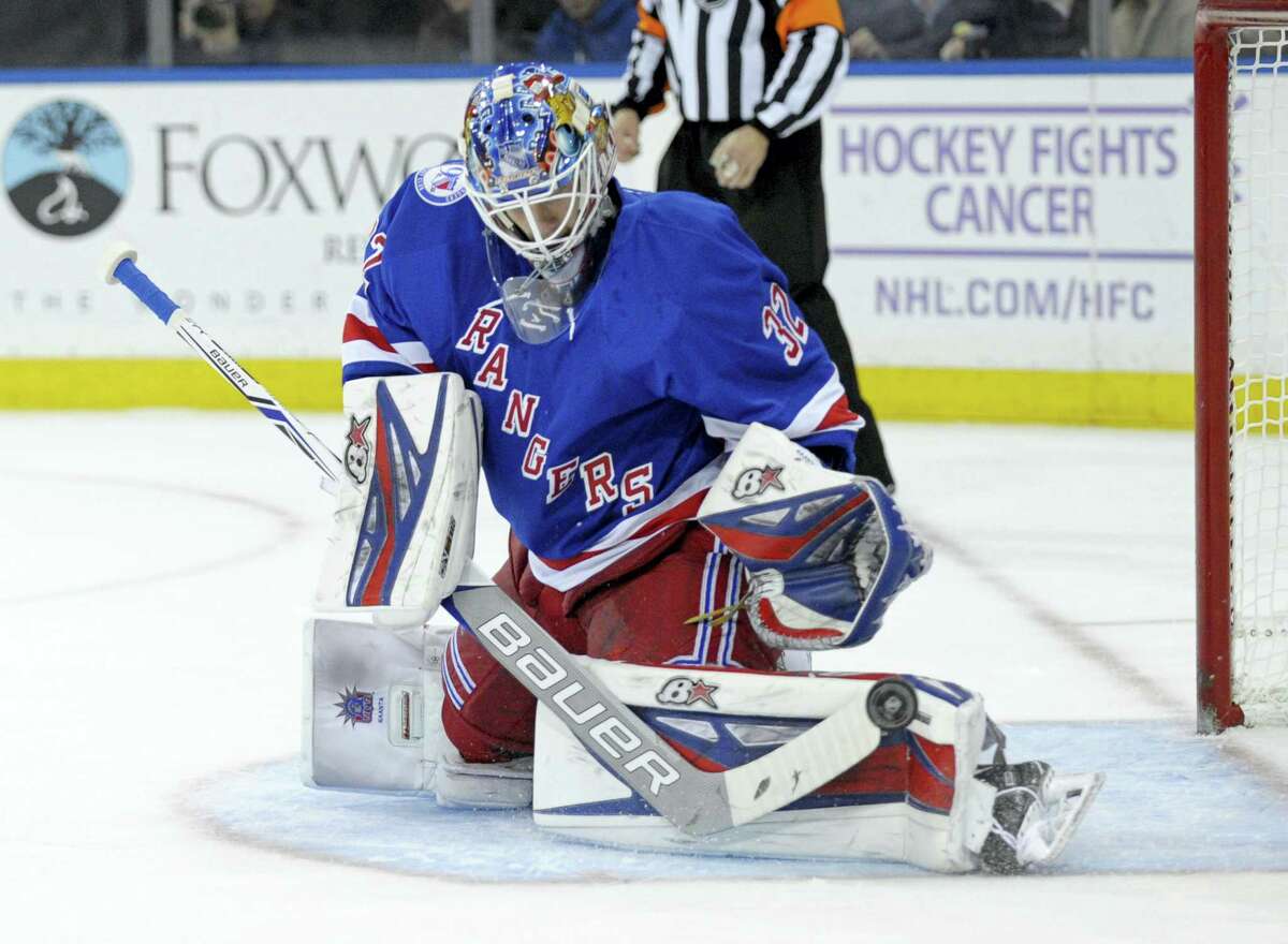 New York Rangers goaltender Antti Raanta deflects the puck during the first period against the Vancouver Canucks.