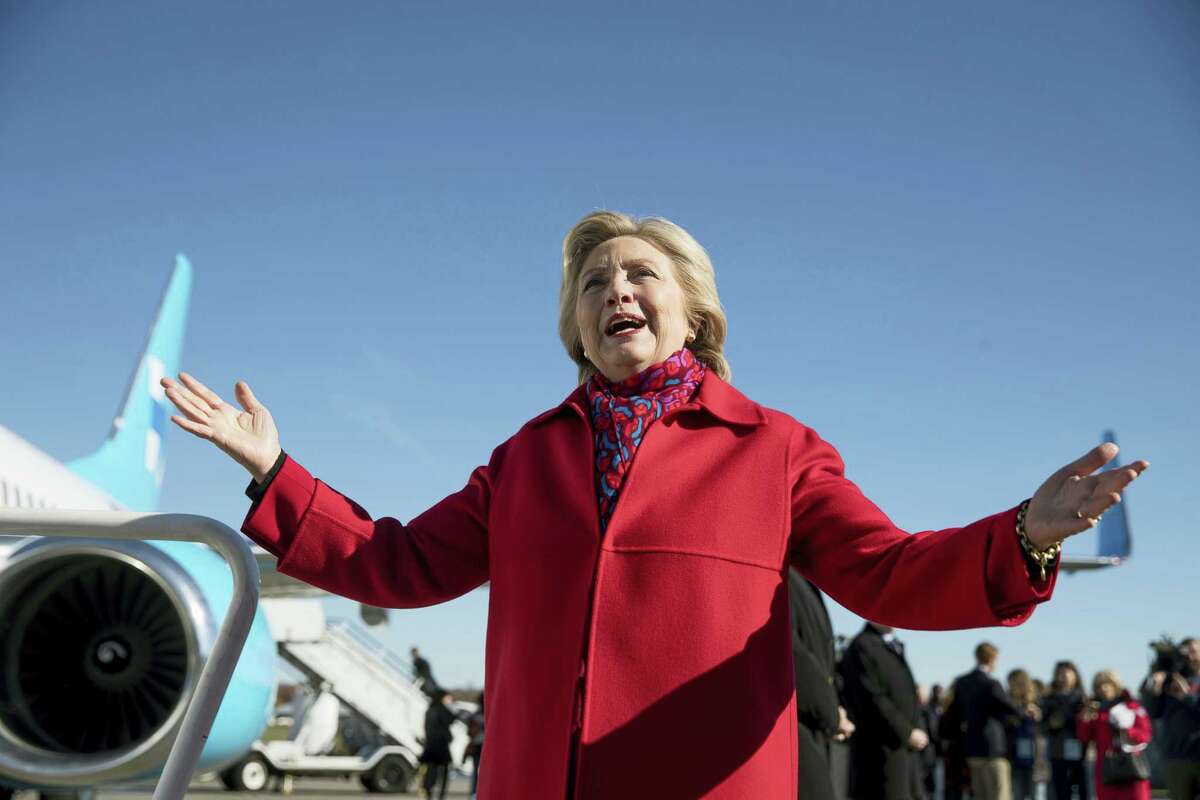 Democratic presidential candidate Hillary Clinton speaks to members of the media before boarding her campaign plane at Westchester County Airport in White Plains, N.Y. on Nov. 7, 2016, to travel to Pittsburgh.