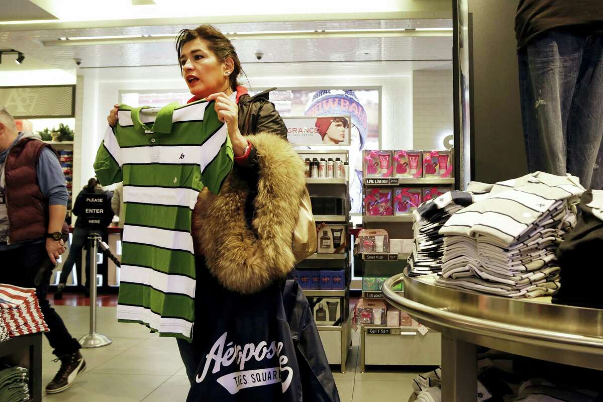 In this Dec. 2, 2015, photo, a woman shops in an Aeropostale clothing store in New York.