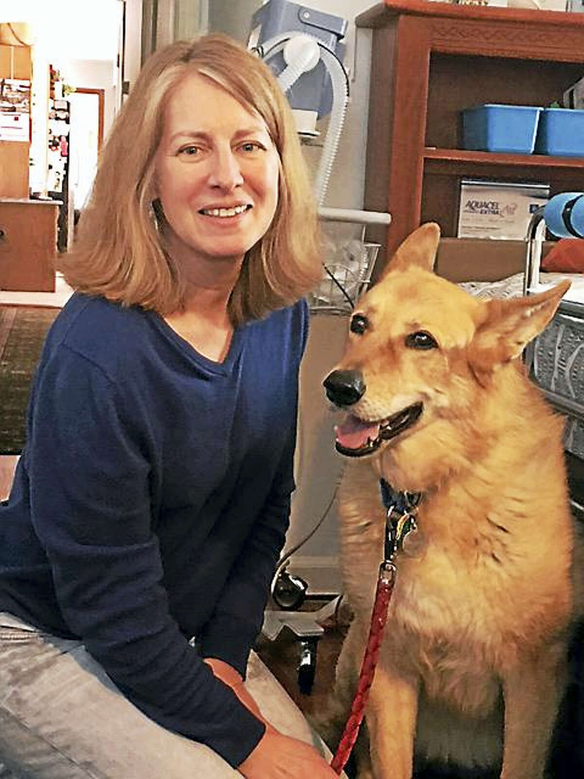 Middlefield resident Annette Olma and her 10-year-old German Shepherd mix Cola are a hospice pet therapy team that have been bringing joy to patients for over six years.