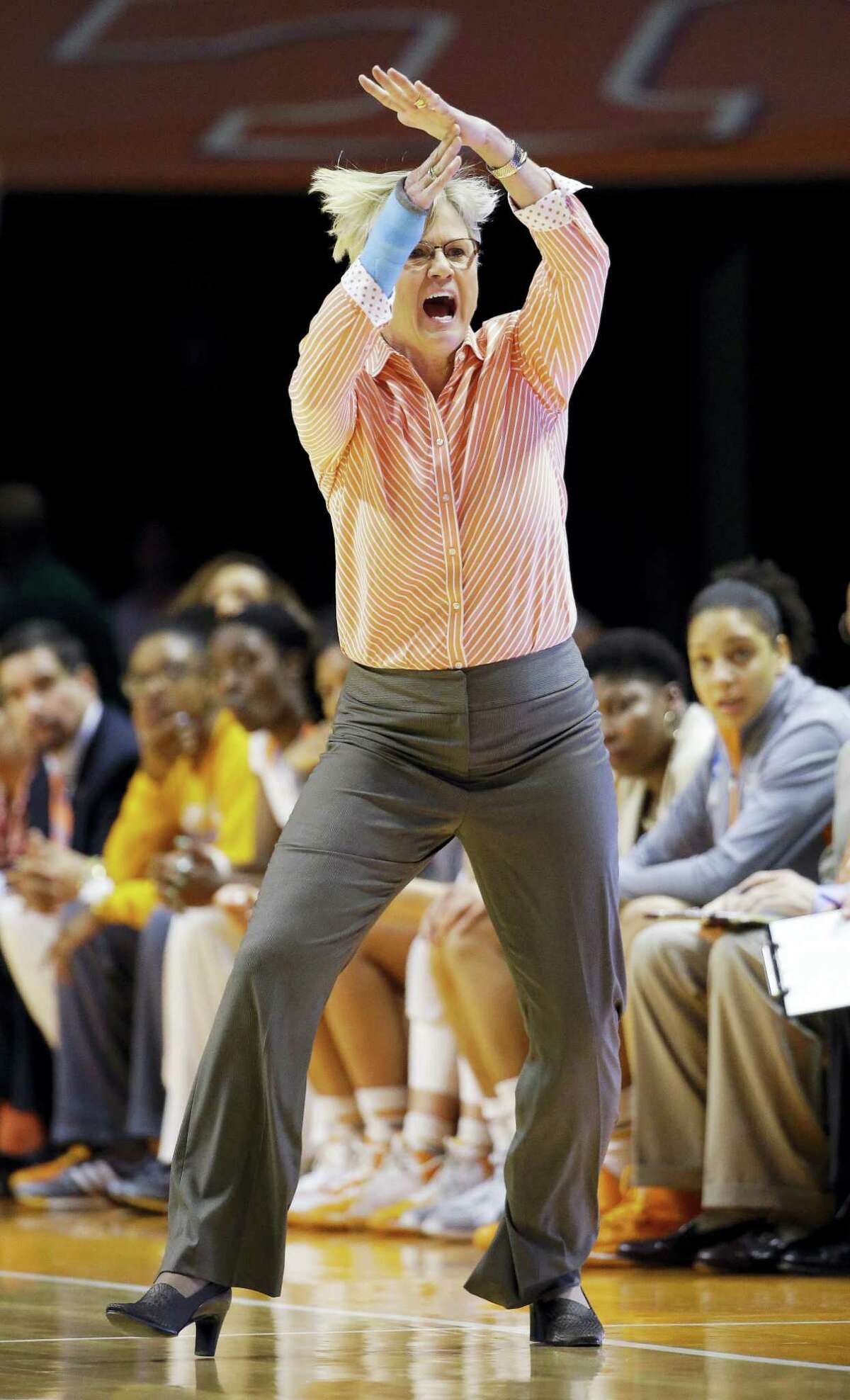 In this March 21, 2015 photo, Tennessee head coach Holly Warlick calls for a timeout in the first half of an NCAA women’s college basketball tournament game against Boise State, in Knoxville, Tenn. The NCAA has altered a rule put into place last season that took away a coach’s ability to call a timeout in live-ball situations. The new variance will allow them to call timeouts now, but only when the team is trying to inbound the ball.