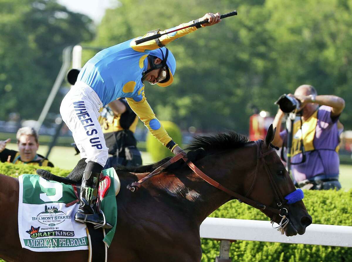 In this June 6 file photo, Victor Espinoza reacts after guiding American Pharoah across the finish line to win the Belmont Stakes at Belmont Park in New York.
