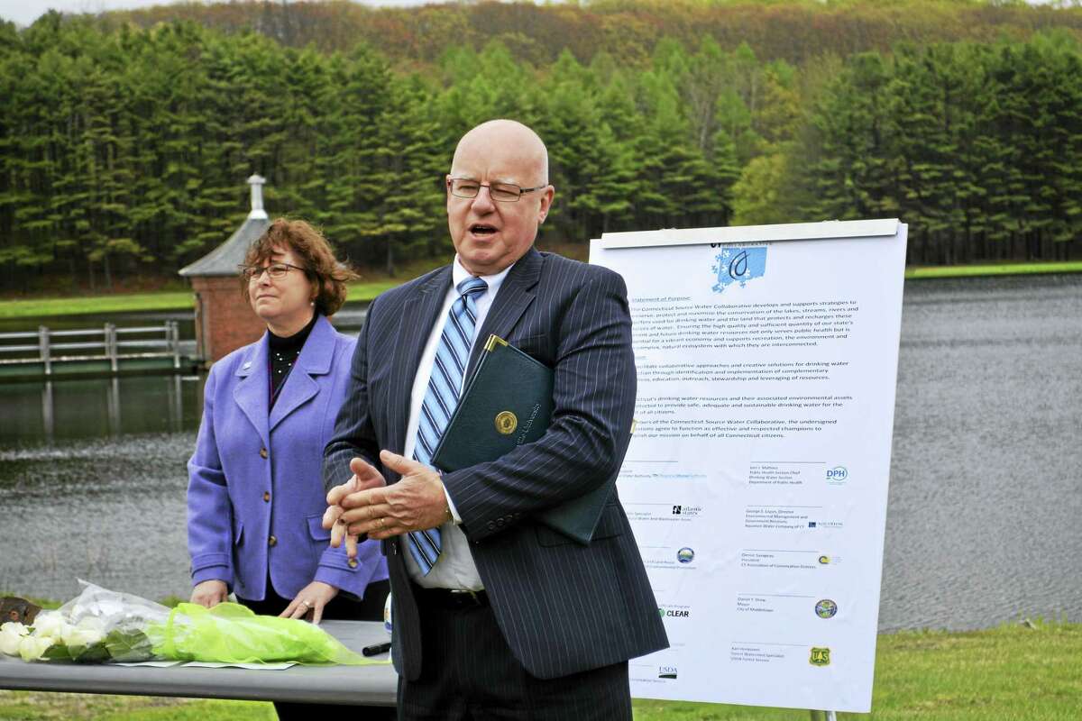 Ted Norris, vice president of the Regional Water Authority, speaks at the Middletown Water Source Collaborative Charter signing Wednesday at the Mount Higby Reservoir as environmental analyst Pat Bisacky from the state Department of Public Health’s Drinking Water Section looks on.