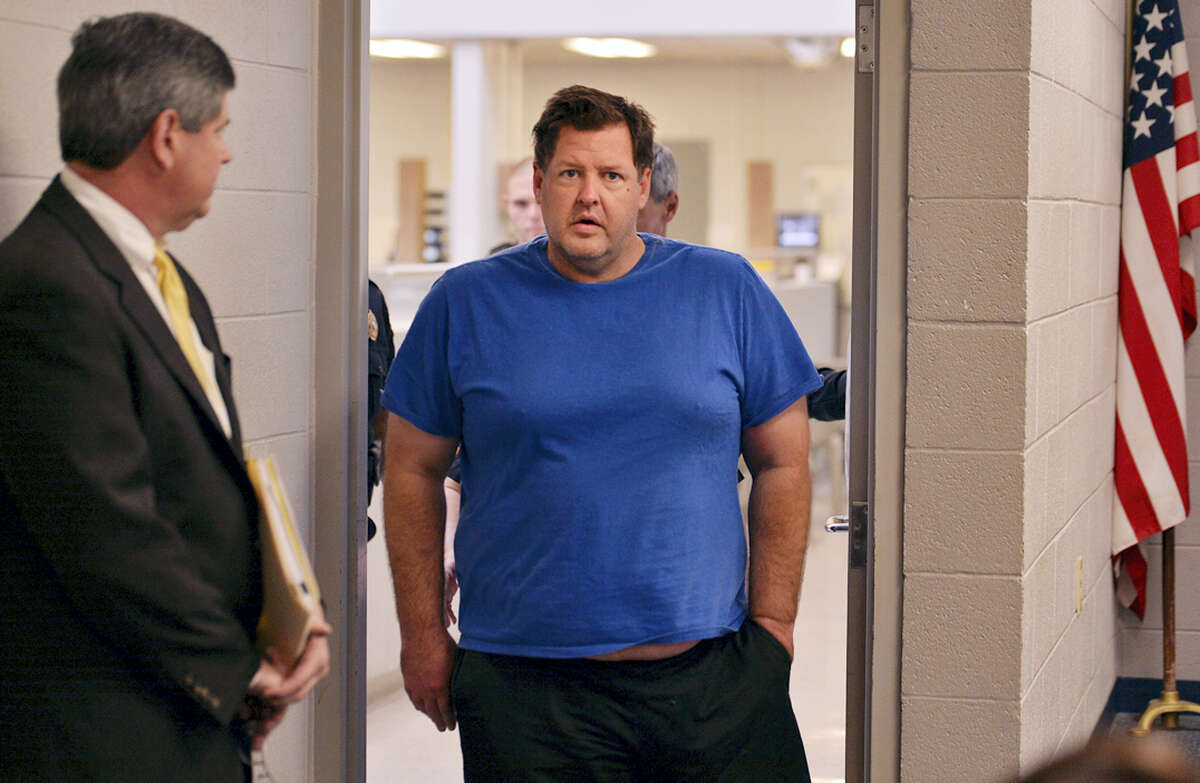 Todd Kohlhepp is escorted into a Spartanburg County magistrate courtroom on Nov. 4, 2016 in Spartanburg, S.C. Kohlhepp, a 45-year-old registered sex offender with a previous kidnapping conviction, appeared at a bond hearing Friday on a kidnapping charge in connection to a woman being found chained inside a storage container on a property in Woodruff, S.C. More charges will be filed later, the prosecutor told the court.