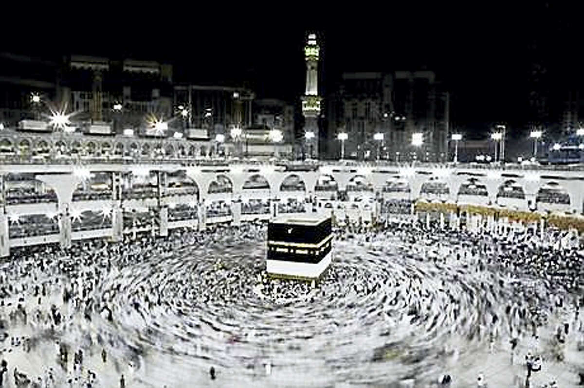 In this Wednesday, Sept. 7, 2016, file photo, Muslim pilgrims circle the Kaaba, Islam’s holiest shrine, at the Grand Mosque in the Muslim holy city of Mecca, Saudi Arabia. Muslim pilgrims have begun arriving at the holiest sites in Islam ahead of the annual hajj pilgrimage in Saudi Arabia, with some weeping with their hands outstretched for a fleeting touch of the Kaaba. The cube-shaped shrine, at the center of Mecca’s Grand Mosque, is the site the world’s 1.6 billion Muslims pray toward five times a day.