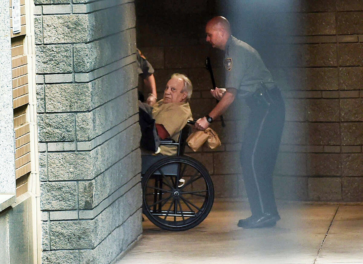 Robert Gentile is brought into the federal courthouse in a wheelchair for a continuation of a hearing in Hartford in 2015.
