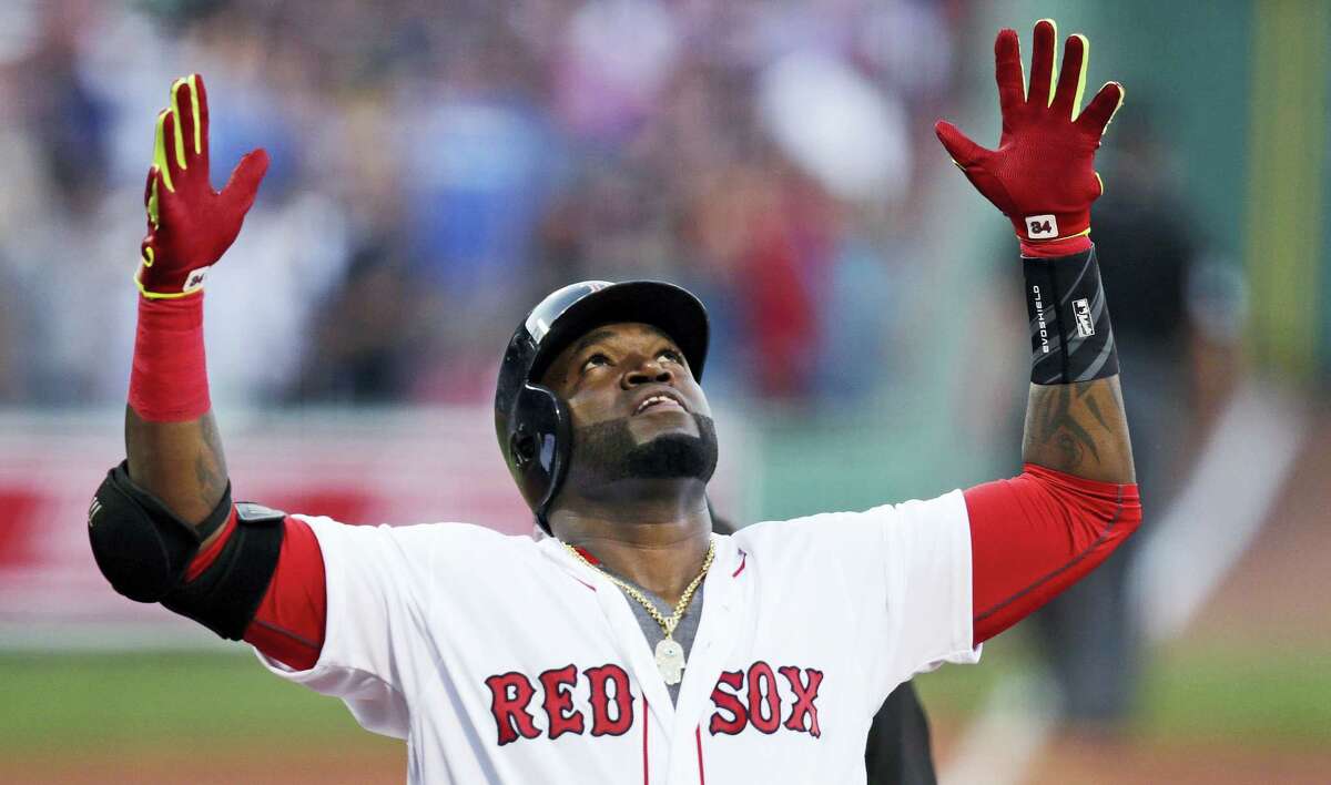 Boston designated hitter David Ortiz celebrates after his two-run home run off Texas Rangers starting pitcher Martin Perez during the first inning at Fenway Park Wednesday. Boston beat Texas 11-6.