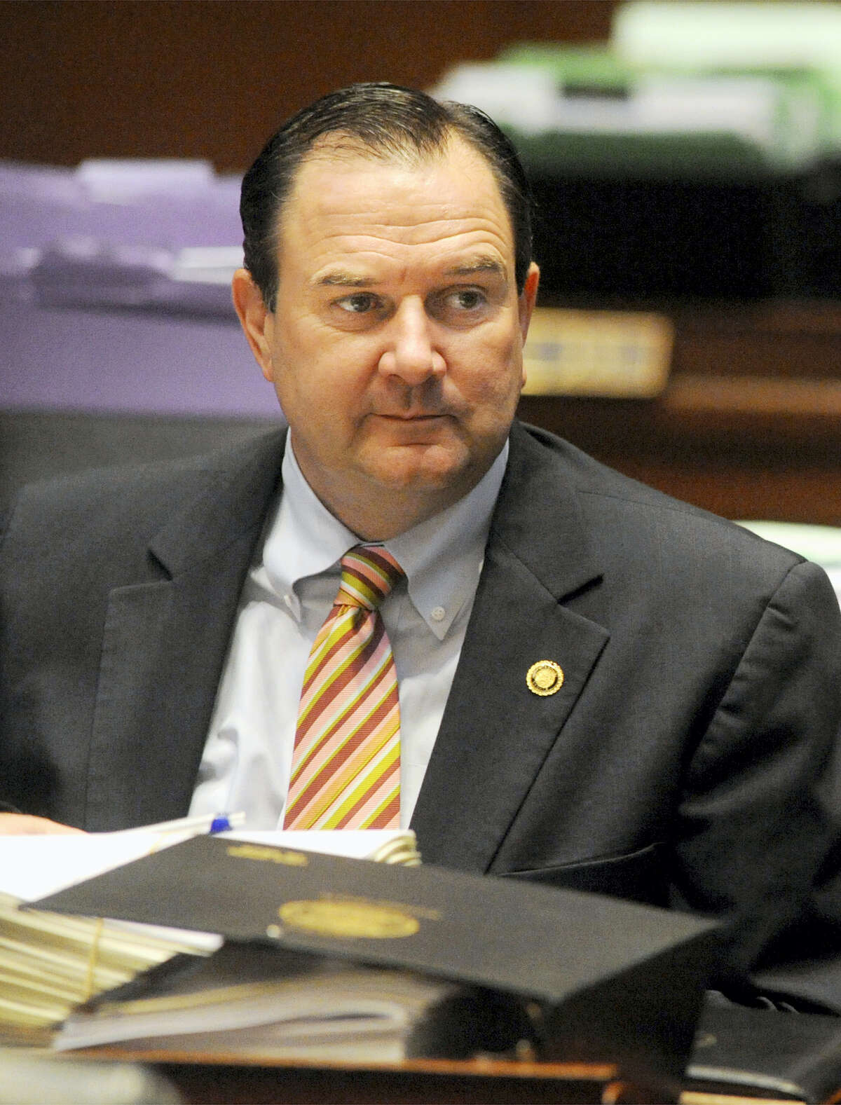 FILE - In this May 2, 2011, file photo, Sen. Mike Kehoe, R-Jefferson City, listens to colleagues debate at the Missouri Capitol in Jefferson City. Kehoe backed a Missouri law, which took effect in 2016, cutting the maximum length of time that people can receive unemployment benefits to as few as 13 weeks.