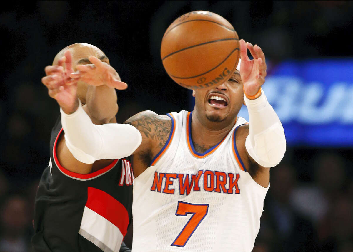 Portland Trail Blazers guard Gerald Henderson knocks the ball from the hands of New York Knicks forward Carmelo Anthony (7) during the first half Tuesday at Madison Square Garden.