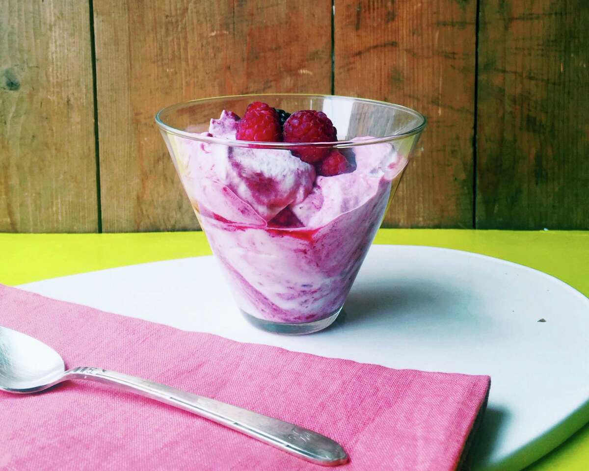 Summer berry fool is a dessert made with pureed fresh berries folded into whipped cream.