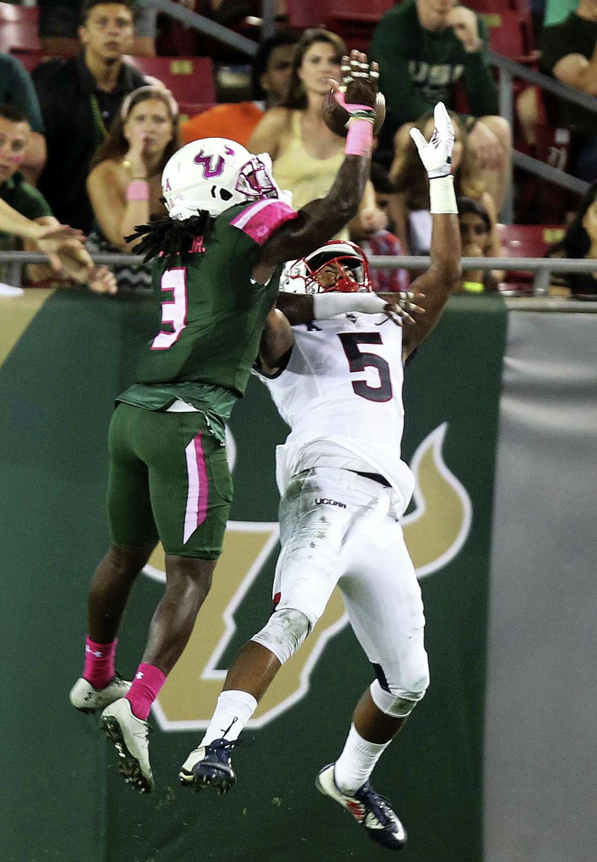 UConn receiver Noel Thomas (5) tries to make a catch against South Florida earlier this season.
