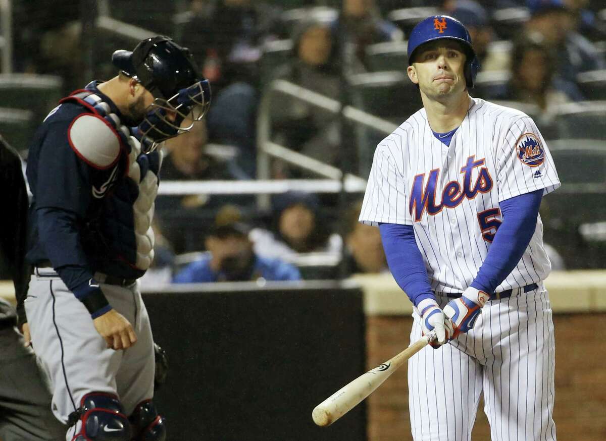 New York Mets David Wright (5) reacts after striking out looking as Atlanta Braves catcher A.J. Pierzynski, left, looks down during the sixth inning of the Mets 3-0 shutout loss to the Braves in a baseball game Tuesday.