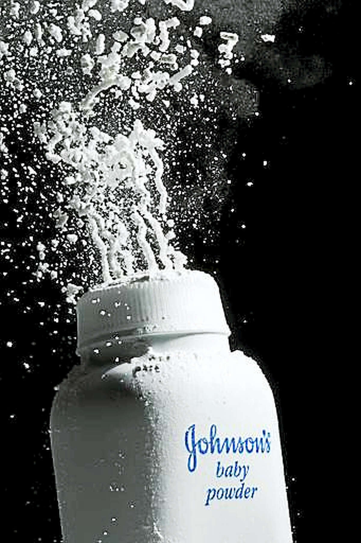 FILE - In this April 19, 2010 file photo, Johnson's Baby Powder is squeezed from its container to illustrate the product, in Philadelphia. A St. Louis jury has ordered Johnson & Johnson to pay a second huge award over claims that its talcum powder causes cancer. The company was ordered Monday, May 2, 2016 to pay a multi- million settlement to a South Dakota woman who blamed her ovarian cancer on years of baby powder use.