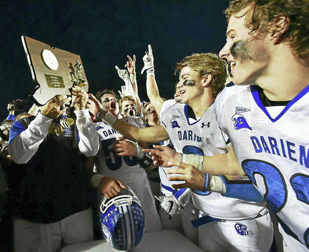 The Darien Blue Wave celebrate after defeating the Shelton Gaels 39-7 for the Class LL state football championship back on December 12, 2015, at New Britain Stadium at Willowbrook Park in New Britain. Darienfinishred No. 1 last season and start the year atop the Register/GameTimeCT Top 10 poll again.