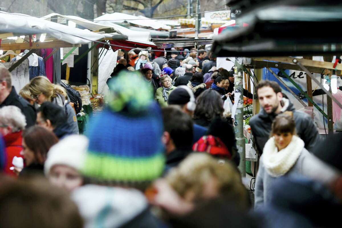In this March 18, 2016 photo, people crowd the so called Turkish market at the district Neukoelln in Berlin, Germany. The market runs mostly by vendors with a Turkish migration background and is located at the borough of Neukoelln which has one of the highest percentage of immigrants in Berlin.
