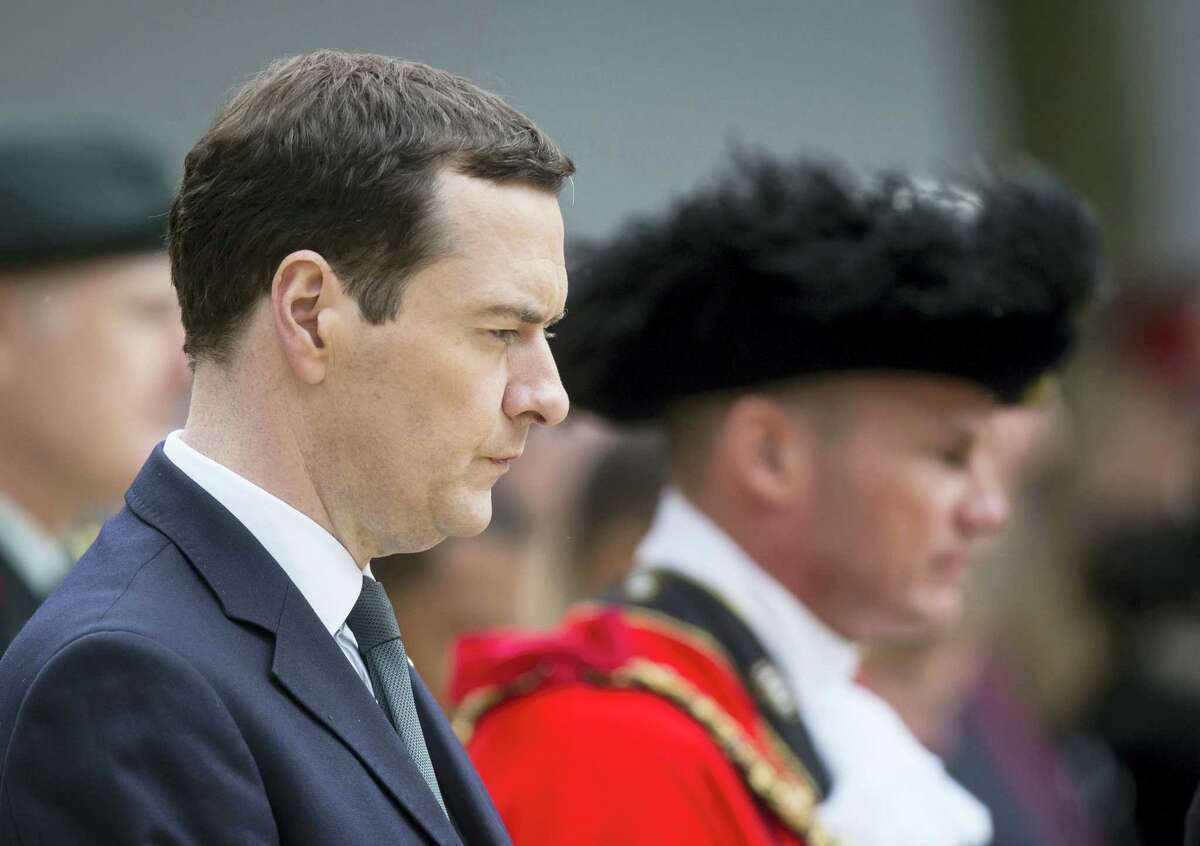 Britain’s Chancellor of the Exchequer George Osborne prepares to lay a wealth at the Cenotaph in St Peter’s Square, Manchester, England, where a commemoration was held to mark the 100th anniversary of the start of the World War I battle of the Somme on Friday.