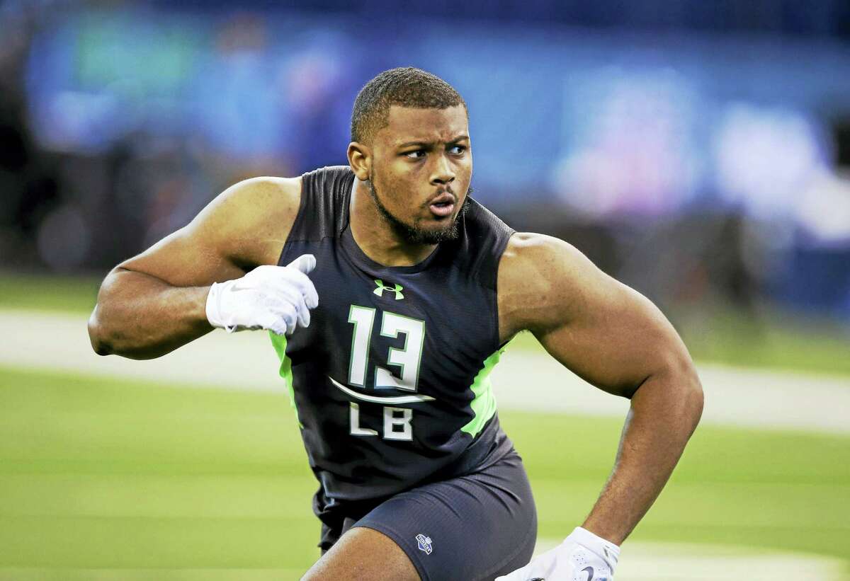 Clemson linebacker B J Goodson runs a drill at the scouting combine in February.