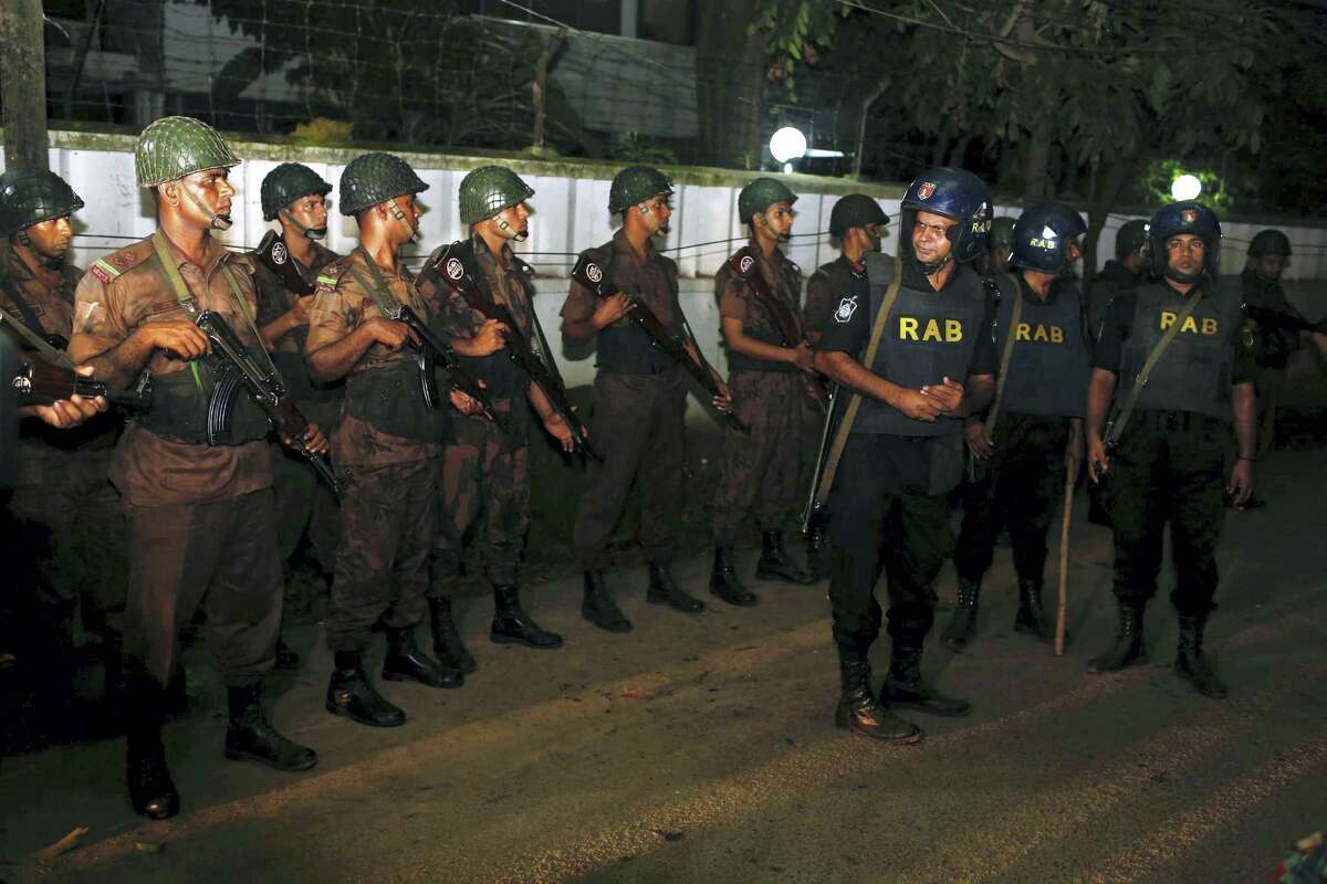 Bangladeshi security personnel cordon off the area after a group of gunmen attacked a restaurant popular with foreigners in a diplomatic zone of the Bangladeshi capital Dhaka, Bangladesh, Friday, July 1, 2016. A group of gunmen attacked the Holey Artisan Bakery in Dhaka’s Gulshan area, taking hostages and exchanging gunfire with security forces, according to a restaurant staff member and local media reports.