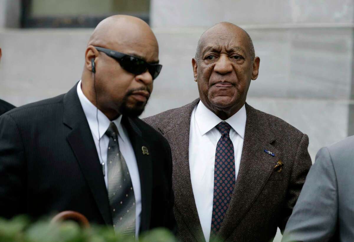Actor and comedian Bill Cosby, right, arrives for a court appearance Feb. 3, 2016 in Norristown, Pa. Cosby was arrested and charged with drugging and sexually assaulting a woman at his home in January 2004.