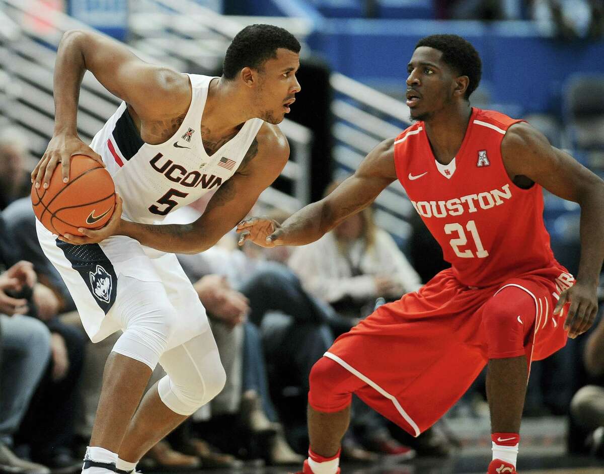 UConn’s Vance Jackson, left, keeps the ball from Houston’s Damyean Dotson during their game on Wednesday.