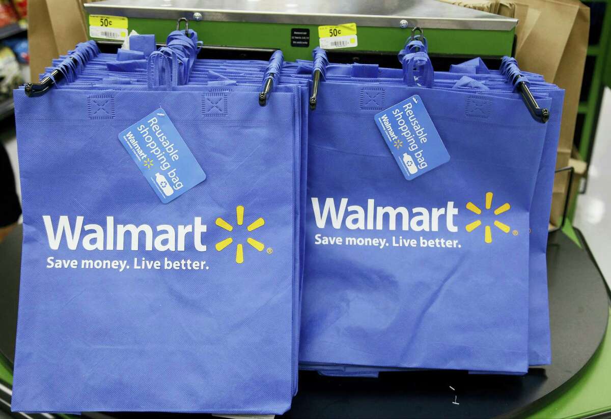 In this, Sept. 19, 2013 photo, reusable shopping bags are offered for sale at a Wal-Mart Neighborhood Market, in the Chinatown district of Los Angeles.