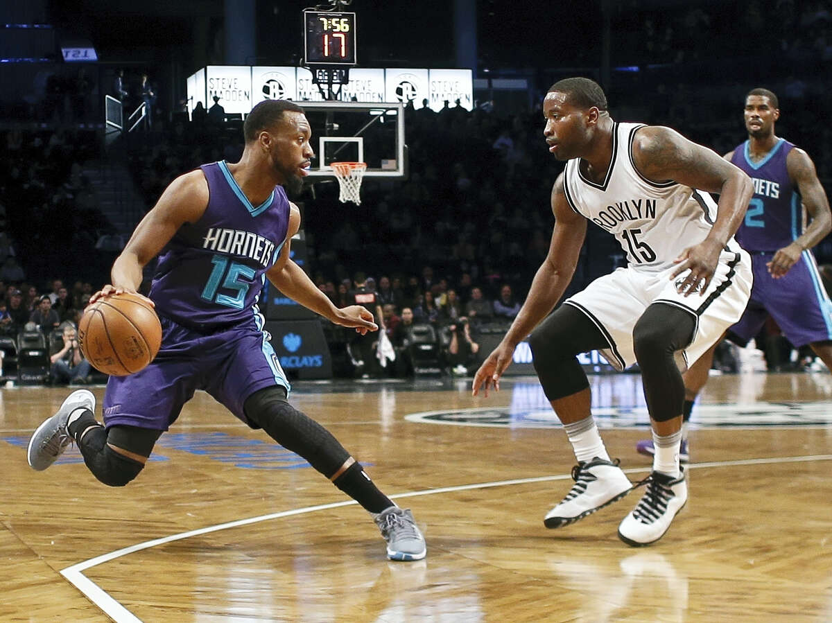 Brooklyn Nets' Donald Sloan (15) defends against Charlotte Hornets' Kemba Walker (15) during the first half of an NBA basketball game Sunday, Feb. 21, 2016, in New York. (AP Photo/Frank Franklin II)