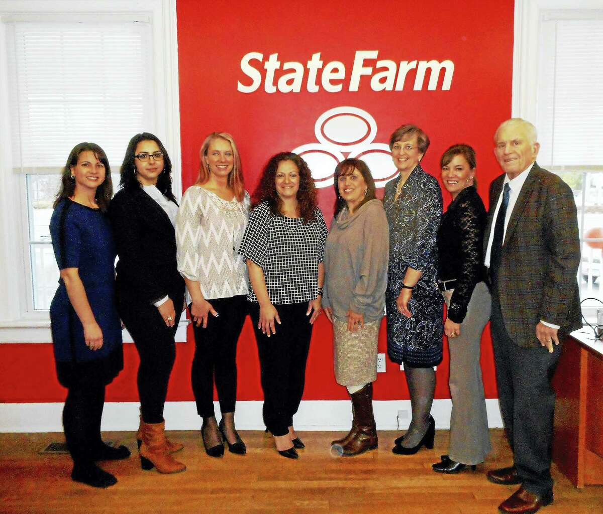 State Farm Insurance in Portland held its grand opening Feb. 4. From left are: state Rep. Christie Carpino, State Farm personal account representatives Kattie Viveiros and Sharon Leland, and owner/agent Mimma Burke; Town Planner Deanna Rhodes, Economic Development Consultant Mary Dickerson, Chamber Vice President Johanna Bond, and Chamber President Larry McHugh.