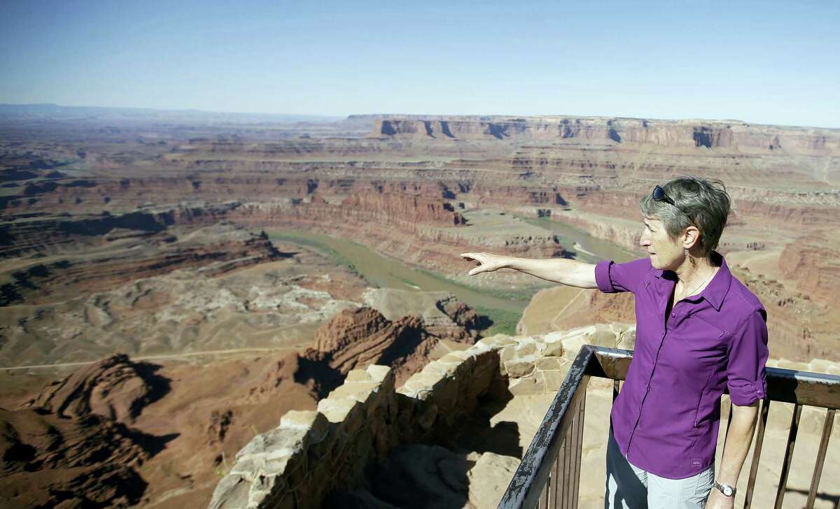 FILE - This July 14, 2016, file photo, U.S. Interior Secretary Sally Jewell looks from Dead Horse Point, near Moab, Utah, during a tour to meet with proponents and opponents to the “Bears Ears” monument proposal. President Barack Obama designated two national monuments Wednesday, Dec. 28, at sites in Utah and Nevada that have become key flashpoints over use of public land in the U.S. West.