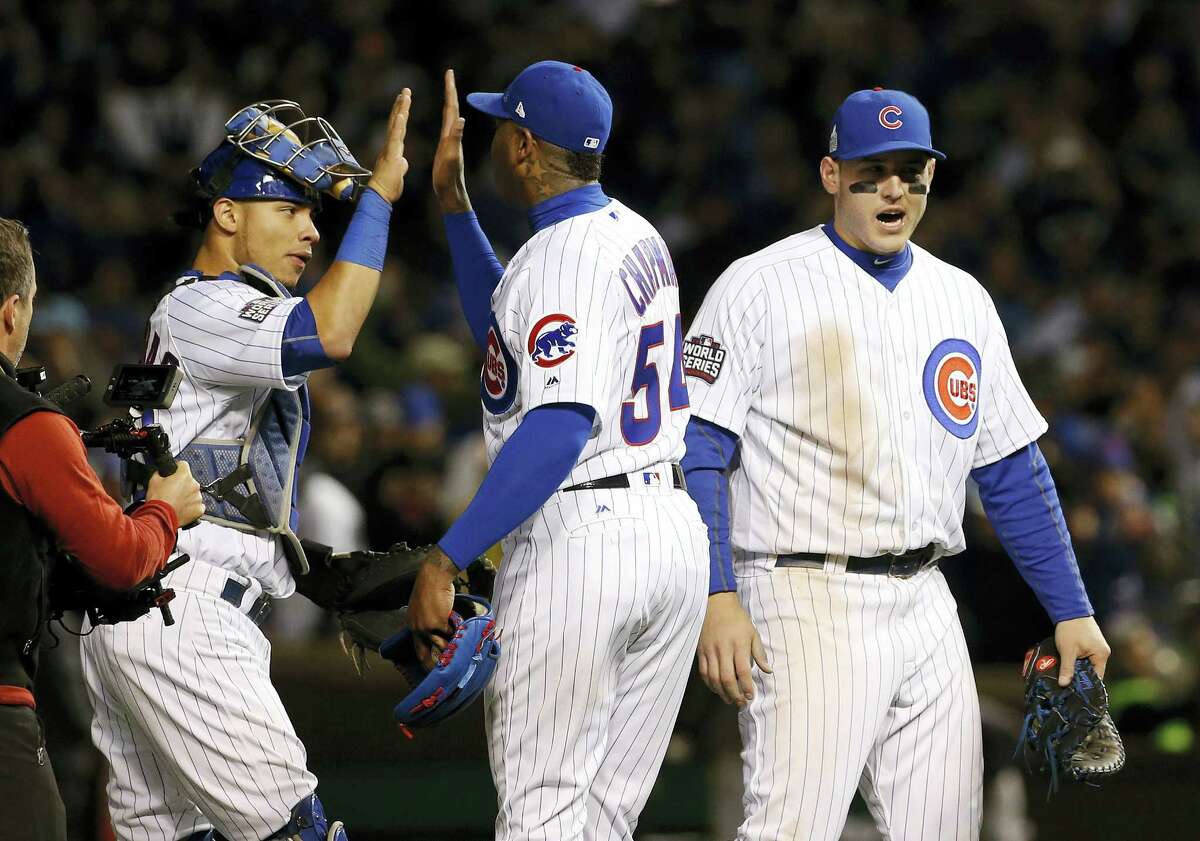 From left, the Cubs’ Willson Contreras, left, Aroldis Chapman and Anthony Rizzo celebrate after Game 5 of the World Series on Sunday night in Chicago.