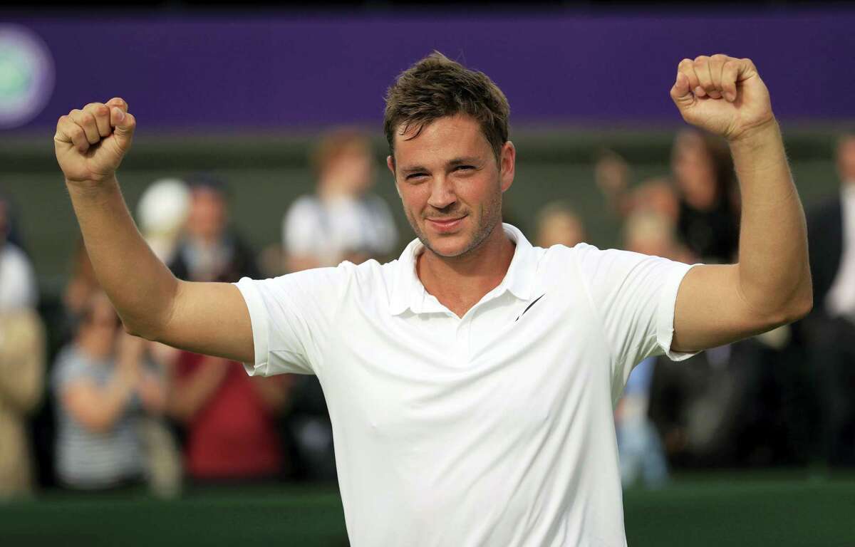 Britain’s Marcus Willis celebrates his victory over Ricardas Berankis in the opening round of Wimbledon on Monday.