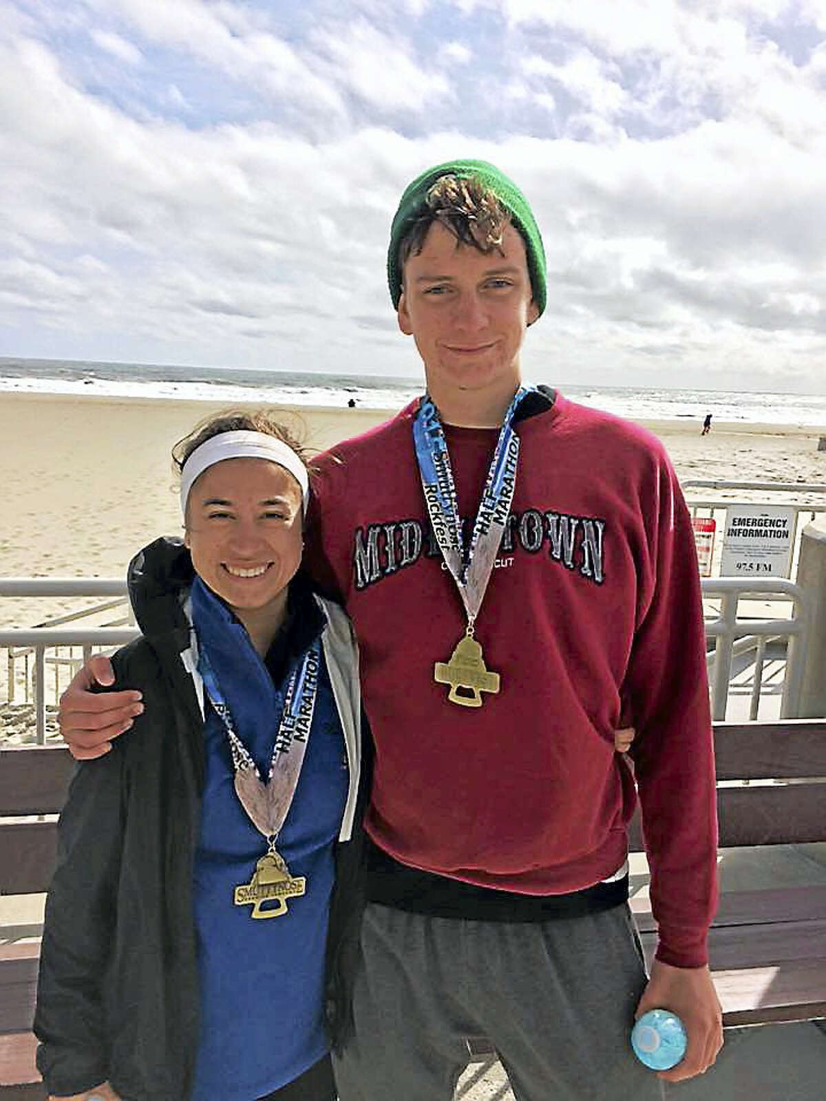 Middletown native Mark Adamiak is running the Boston Marathon in April to raise money for Playworks, a nonprofit that improves school climates, reduces bullying and increases student engagement through the power of play. He is shown with his girlfriend Lisa Giorgetti, left, after the Smuttynose Rockfest Marathon in Hampton Beach, New Hampshire, in October 2015.