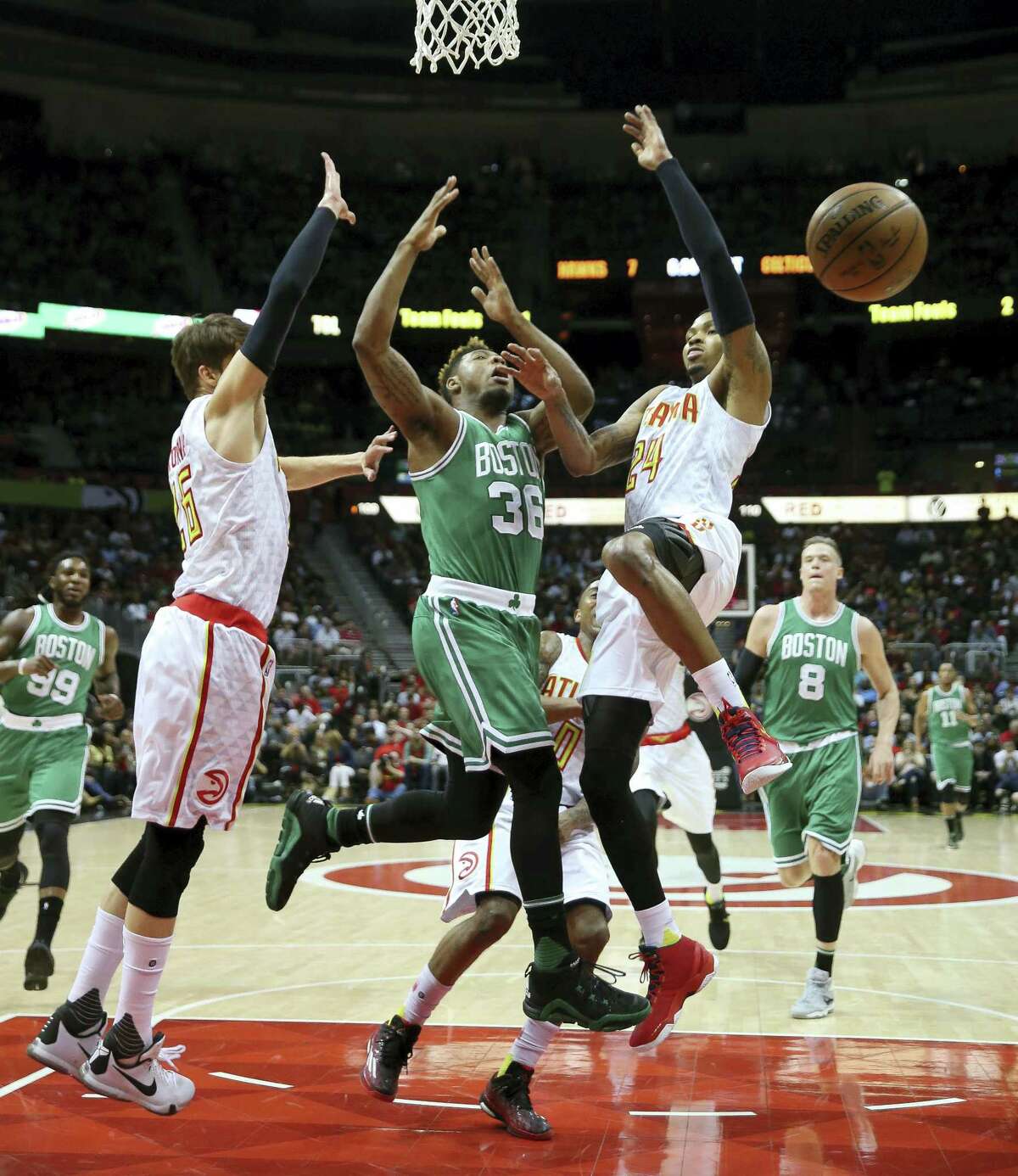 Celtics guard Marcus Smart (36) loses control of the ball as he tries to drive to the basket.
