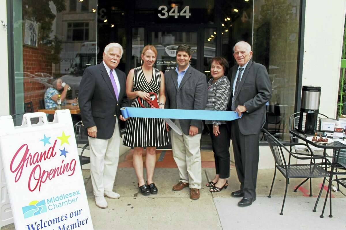 Perk On Main, a coffee and crepe house focused on locally grown food and environmentally sustainable coffee, held its grand opening on Main Street June 23. From left are Middletown Small Business Development Counselor Paul Dodge, owner/crepe artist Katie Hughes-Nelson, Middletown Mayor Dan Drew, chairperson of the Downtown Business District Diane Gervais and president of Middlesex County Chamber of Commerce Larry McHugh.