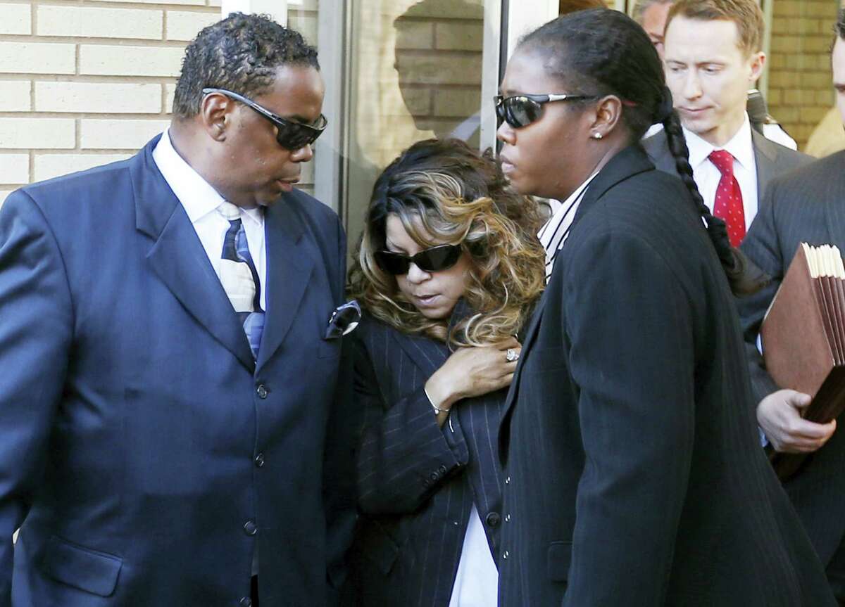 In this May 2, 2016 photo, Tyka Nelson, center, the sister of Prince, leaves the Carver County Courthouse in Chaska, Minn. where a judge confirmed the appointment of a special administrator to oversee the settlement of the late entertainer’s estate.