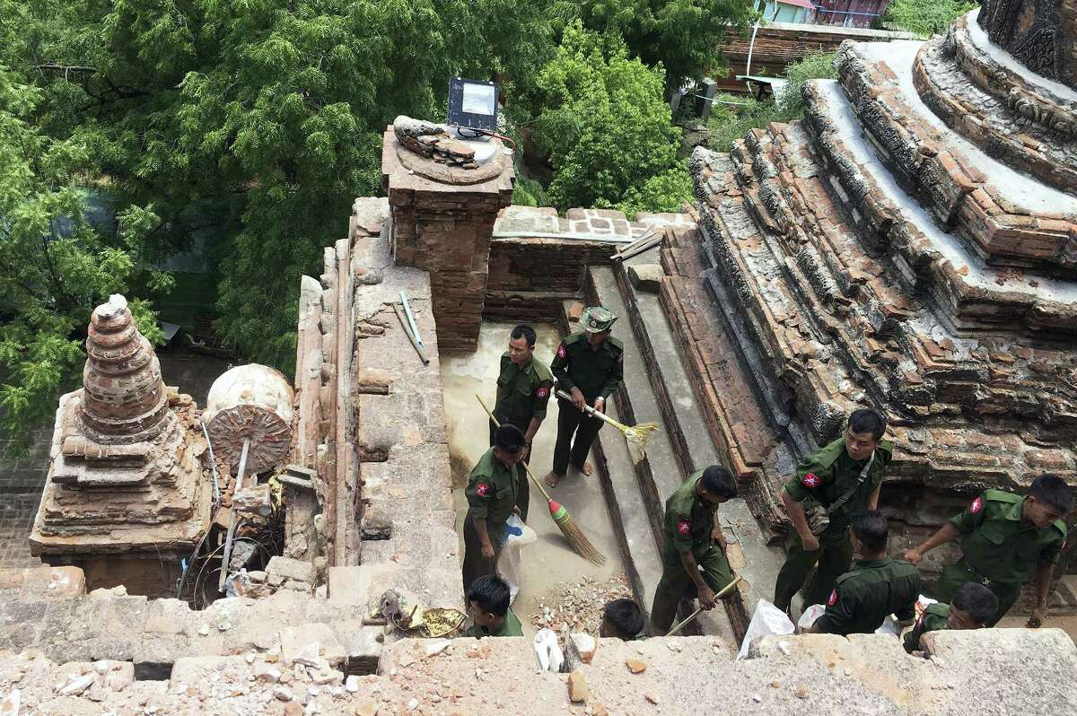 Military personnel clear debris at a temple that was damaged by a strong earthquake in Bagan, Myanmar on Aug. 25, 2016. Using brooms and their hands soldiers and residents of the ancient Myanmar city famous for it’s historic Buddhist pagodas, began cleaning up the debris from a powerful earthquake that shook the region and damaged nearly 200 temples Wednesday.