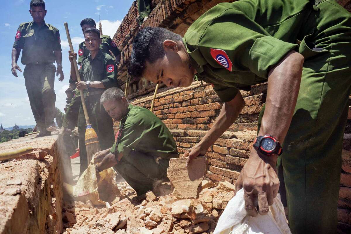 Myanmar Military personnel examine the Htilominlo Pagoda in Bagan, Myanmar on Aug. 25, 2016.